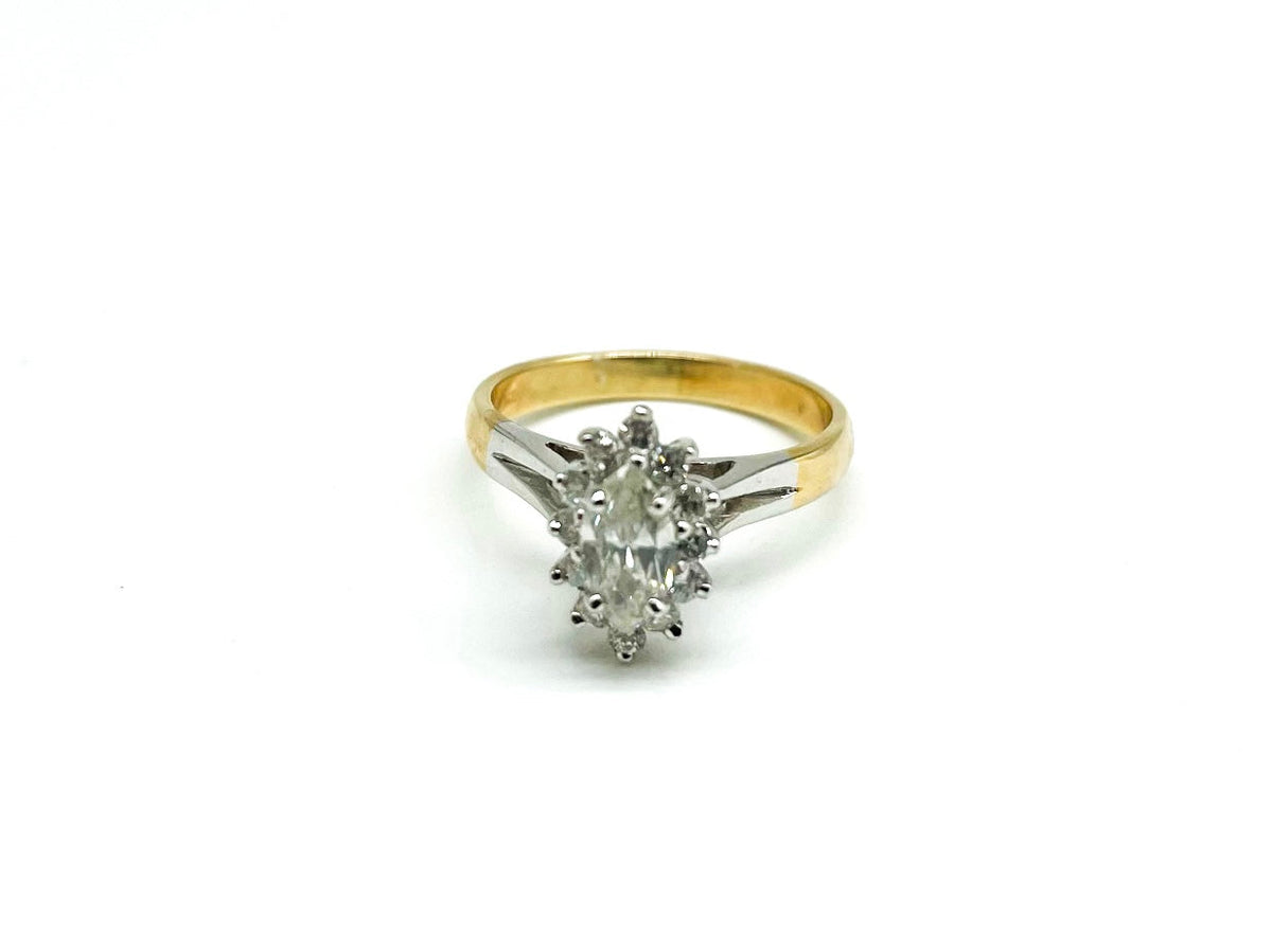 .70 Point Oval Cut and .12 Point Round Brilliant Diamond Ring