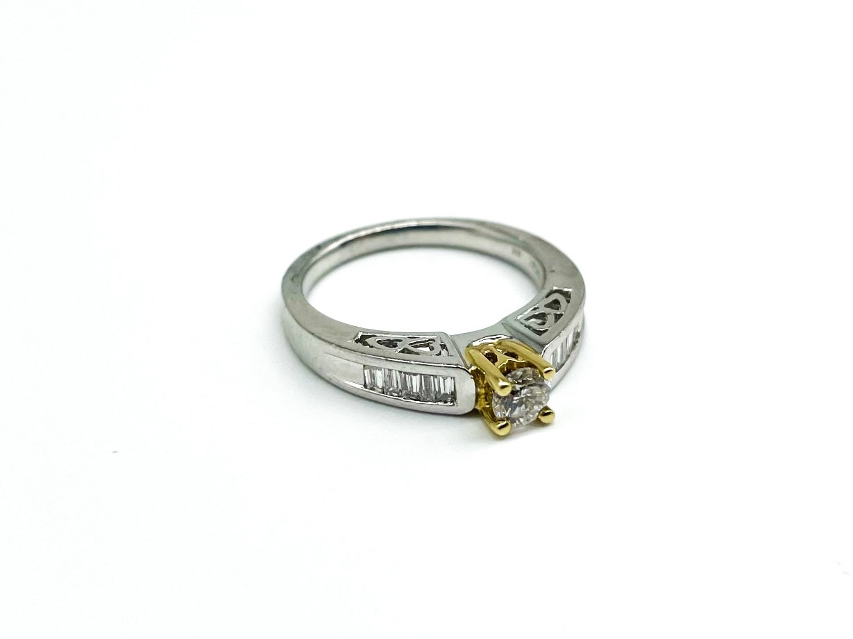 .28 Point Round Brilliant and .50 Point Baguette Diamond Ring