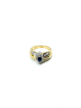 .35 Point Marquise Cut and .60 Point Round Brilliant and Baguette Diamond Ring