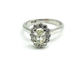 56 Point Oval Cut and .40 Point Round Brilliant Diamond Ring