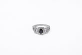 .50 point Oval Cut, .40 point Baguette Cut, and .78 point Round Brilliant Cut Diamond Ring