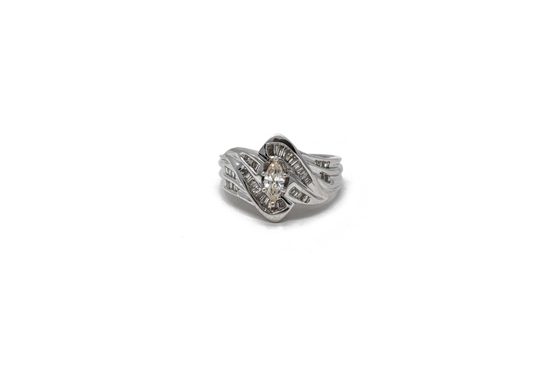 .31 point Marquise Cut and .40 point Tapered Baguettes Cut Diamond Ring