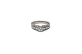 .51 point Round Brilliant Cut and .50 point Straight Baguettes in Princess Cut Round Brilliant Cut Diamond Ring