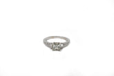 1.05 point Princess Cut, .14 point Tapered Baguette, and .21 point Round Brilliant Cut Diamond Ring