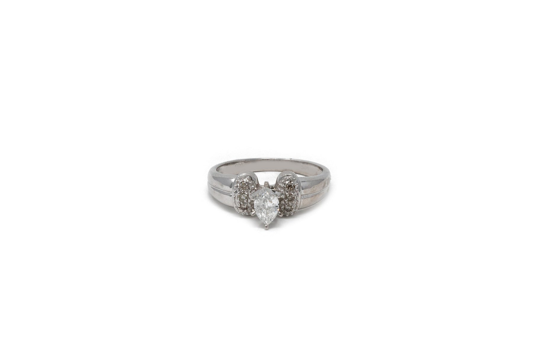 .35 point Marquise Cut and .08 point Round Brilliant Cut Diamond Ring