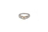 .26 point Round Brilliant Cut and .24 point Baguette Cut Diamond Ring