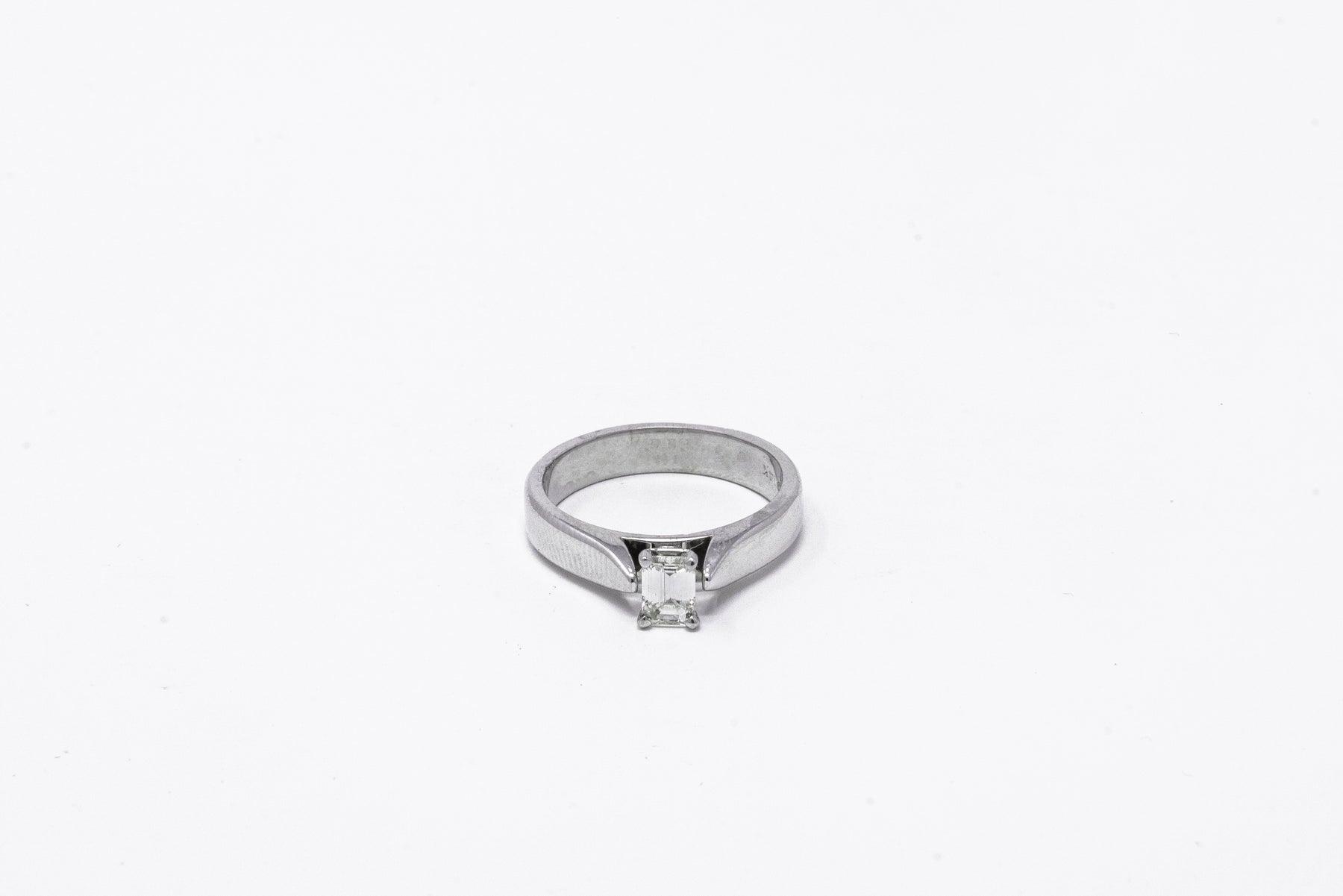 .39 point Round Brilliant Cut and .45 point Baguette Cut Diamond Ring