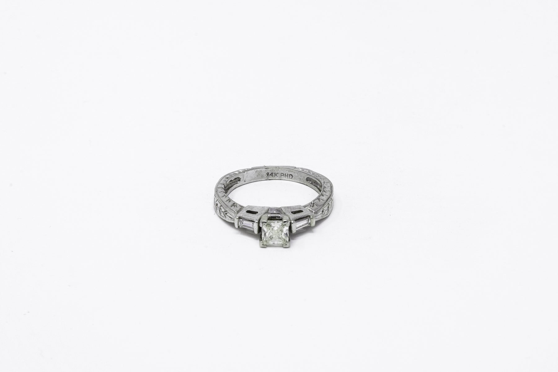 .52 point Princess Cut and .18 point Tapered Baguette Cut Diamond Ring